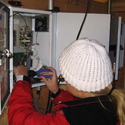 Image: an AQRC staff member attends to a module at a sampler site.