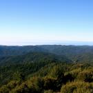 Image: a clear day overlooking the horizon at Cahto Peak.